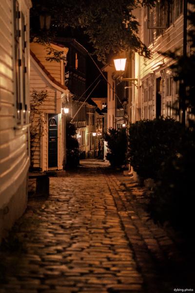 Traditional wood houses in alleyway at night - Bergen