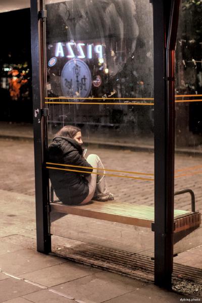 Girl waiting for the night-bus home